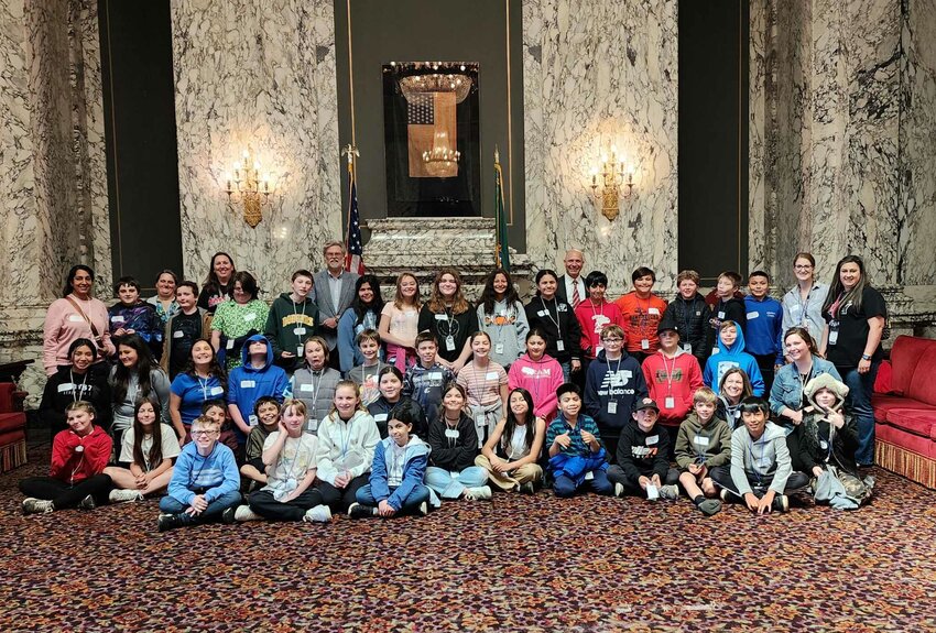 Students from Edison Elementary in Centralia pose for a photo with state Reps. Peter Abbarno and Ed Orcutt, both standing in the back row, at the state Capitol during a recent tour.