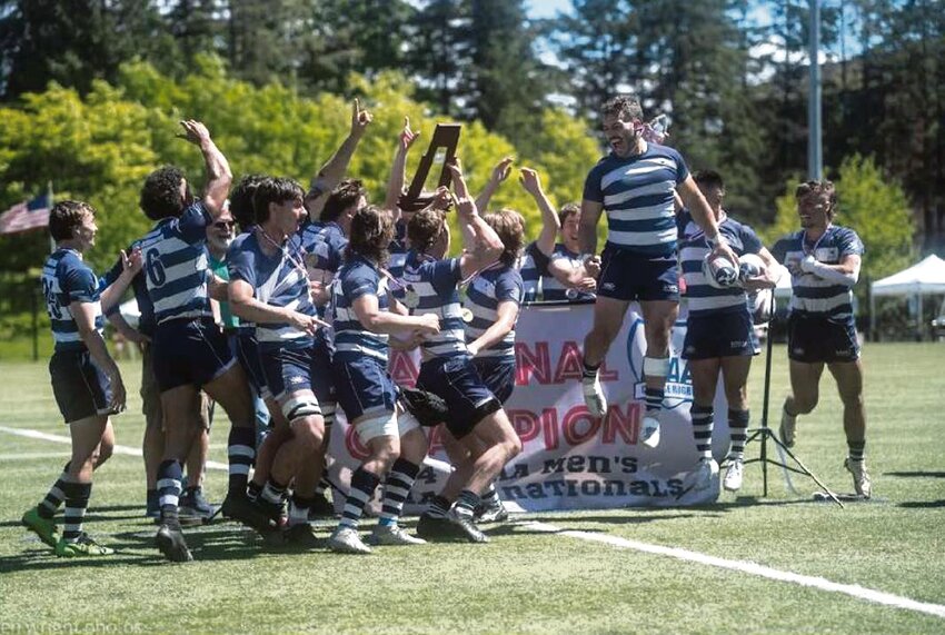 Nathan Mathis jumps in the air after Western Washington University's rugby team secured the D1AA 7's Rugby National Championship.