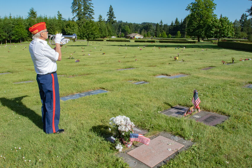 U.S. Marine Corps Vietnam War veteran Ken Dobler plays Taps at the grave of his father &mdash; a Marine WWII veteran &mdash; on Thursday, June 6, the 80th anniversary of the D-Day Normandy invasion and also his father's birthday at the Claquato Cemetery in Chehalis.