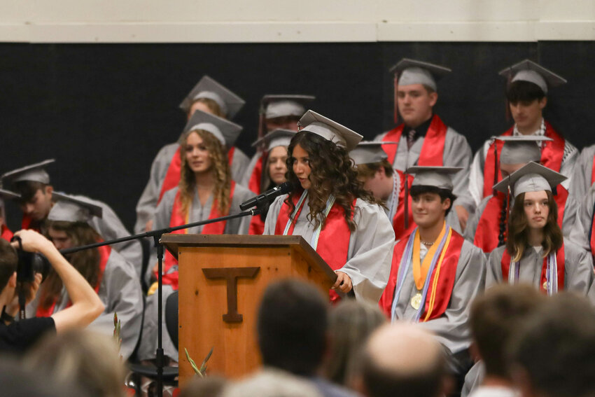 Class Secretary Maritza Salmeron welcomes the crowd and her classmates to Toledo's graduation ceremony at the high school on June 8.