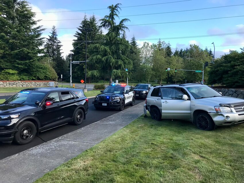 A male driver was arrested on suspicion of multiple crimes Sunday morning after fleeing from law enforcement and crashing his car at the entrance to an area golf and country club, according to the Thurston County Sheriff's Office.