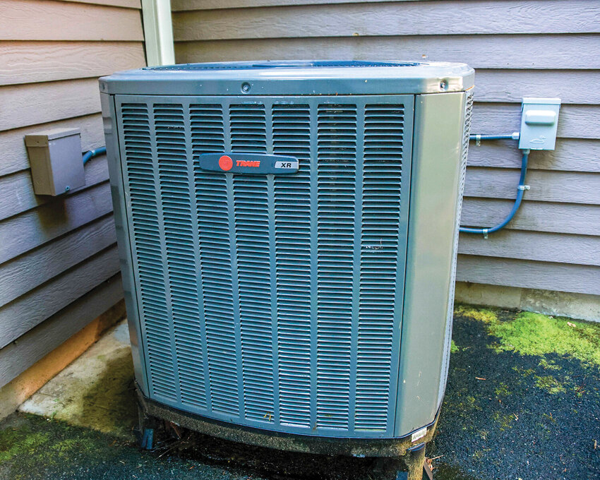 A heat pump stabilizes a home’s temperature by extracting hot air out of the house during the summer.