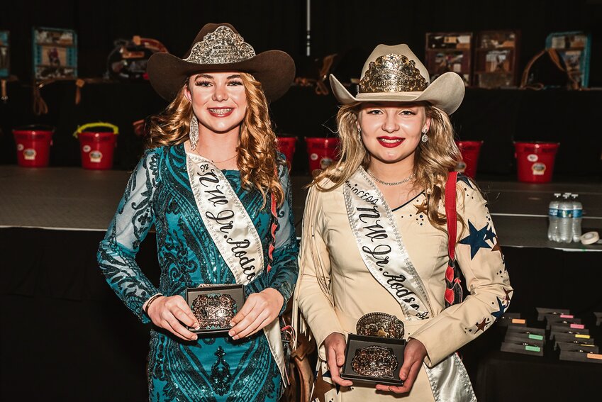 Northwest Junior Rodeo Association Queen Brooklynn Bell (left) and Princess Emma Gulley (right) pose with their hardware on Feb. 24.