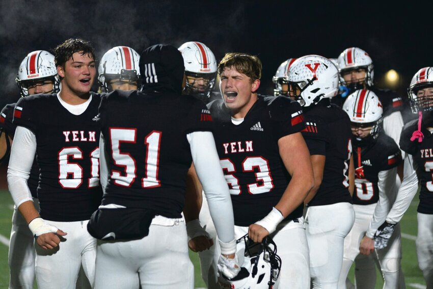 Yelm linemen Chris Hauss (61), Damien Williams-Butler (51) and Jonah Smith (63) celebrate on Nov. 25, 2023, after defeating the Eastside Catholic Crusaders, 7-0, to advance to the 3A State Championship game against Bellevue.