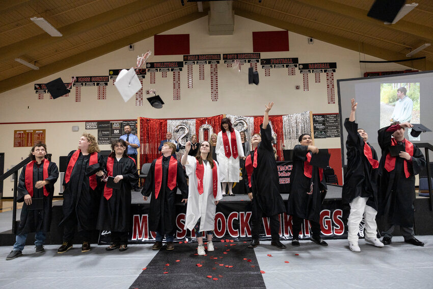 Gradutes throw their caps during the Mossyrock Academy graduation ceremony on Monday, June 10. The class of 10 tied with the class of 2022 for the most graduating students.