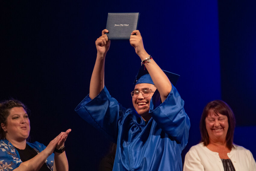 Carlos Monreno Perez accepts his diploma during the Futurus High School class of 2024 graduation ceremony at the Centralia Community Church of God on Tuesday, June 11.