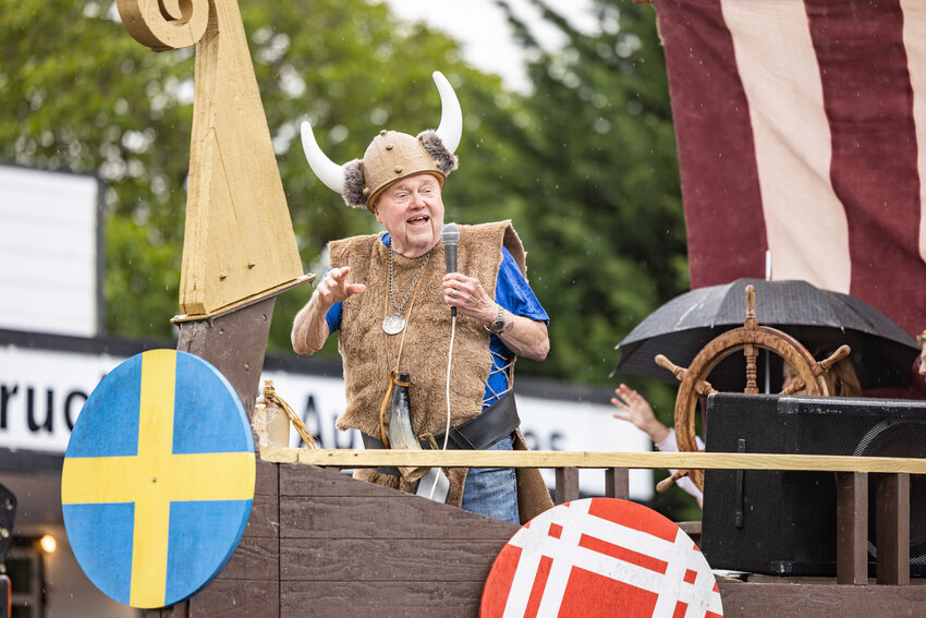 A man dressed as a viking waves to the crowd during the Swede Day Rochester Mid-Sommar Festival Parade on Saturday, June 15.