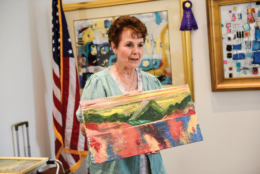 JoyLynn Woodart, a founding member of Art Chat and current member of the Battle Ground Art Associates, shows her acrylic painting progress at Art Chat’s June Ridgefield meeting.