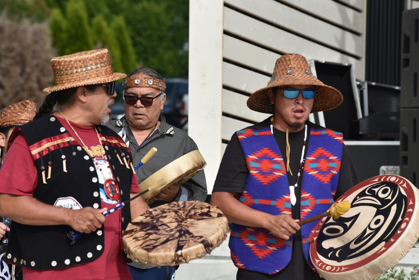 Hanford McCloud and members of the Nisqually Indian Tribe sing native songs and bless the stage at Yelm City Park, built by Nisqually Construction, on June 22.