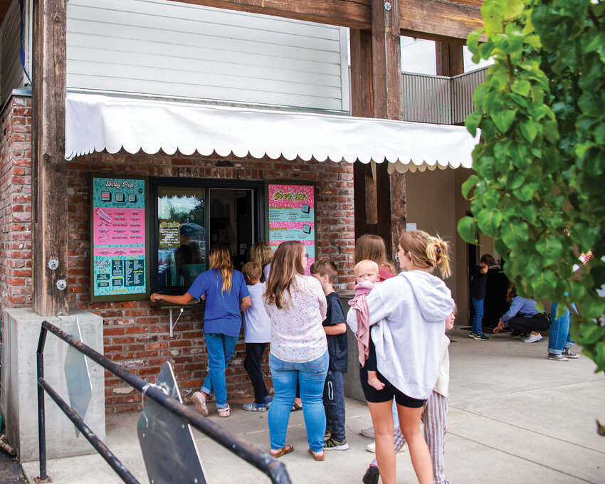Over Ice and Soda and Beverages opened business to the community in Battle Ground on June 22. Each day since the grand opening, consistent, fast-moving lines of thirsty customers have packed the sidewalk in front of their soda shop.