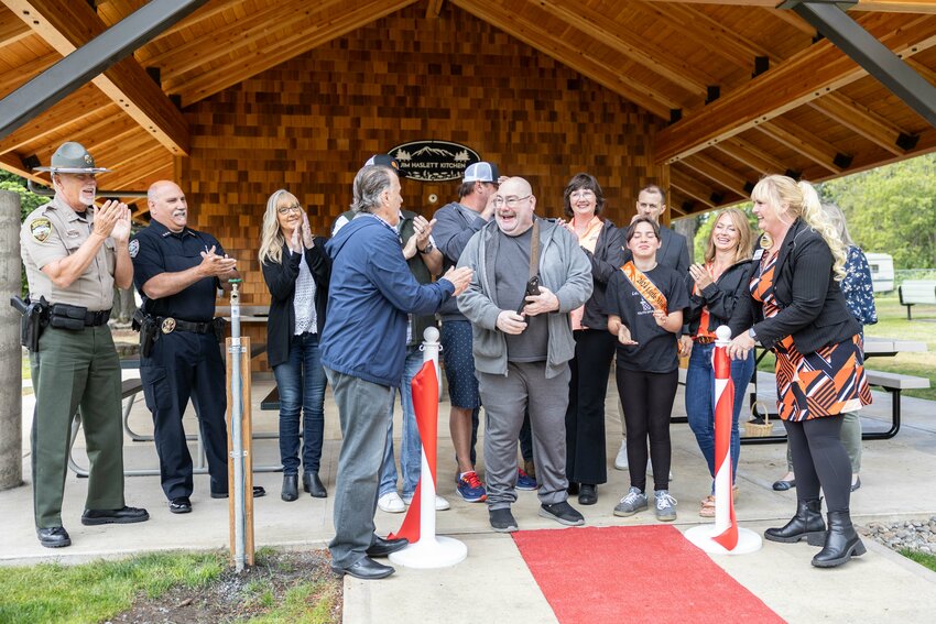 People applause during the ribbon-cutting ceremony for the Jim Haslett Kitchen at Mayme Shaddock Park in Napavine on Thursday, June 27.