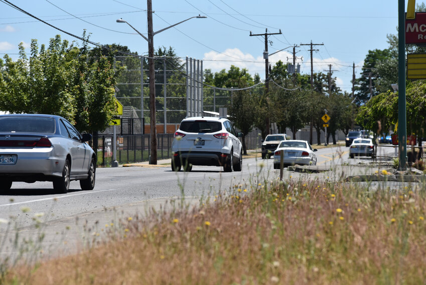 Cars travel on West Yelm Avenue on Friday, June 28.