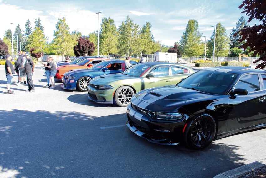 Members of Mopar Nation park at Yelm Family Medicine before their cruise on June 29.