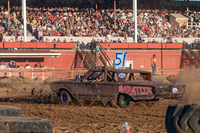 A driver completes a heat race in reverse after their vehicle was spun out in the second lap at the Summerfest Demolition Derby at the Southwest Washington Fairgrounds on Thursday, July 4.