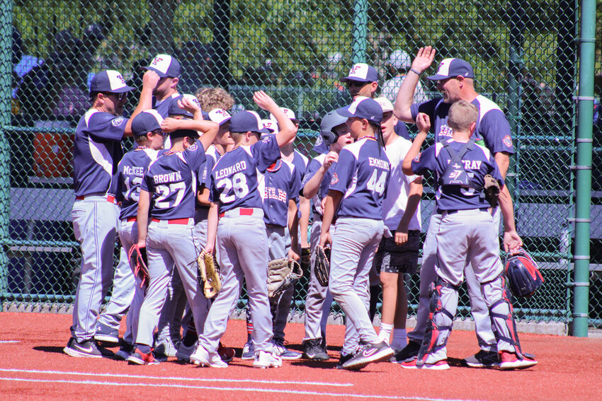 The Nisqually Basin Youth Baseball 11-U Tornados huddle after losing to the FCA 11-U Lumberjacks in the Cal Ripken state tournament at the Regional Athletic Complex on July 5.