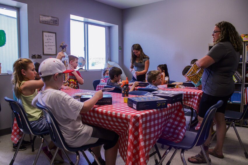 Michelle Stephan instructs students how to use their robotics kits during YARD's first robotics class on July 8.