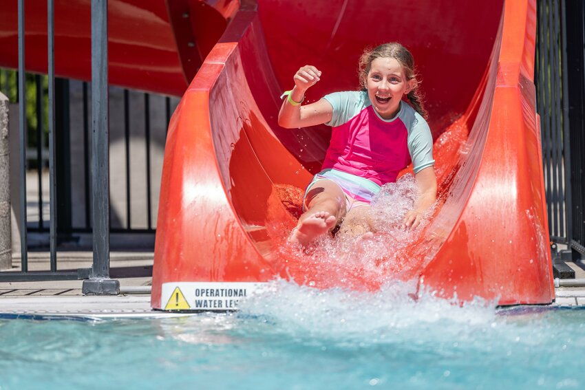 Emily Durbin goes down a slide at the Gail and Carolyn Shaw Aquatics Center in Chehalis on Tuesday, July 9.