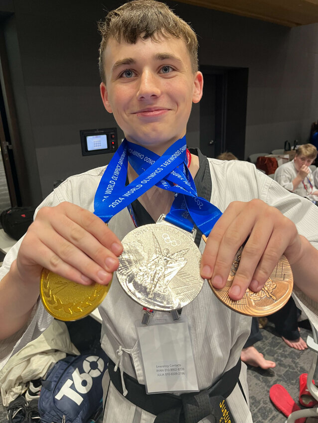 Justus Stoker poses with three of the five medals that he won at the 2024 World Olympic Taekwondo Championship in Seoul, South Korea on June 30.