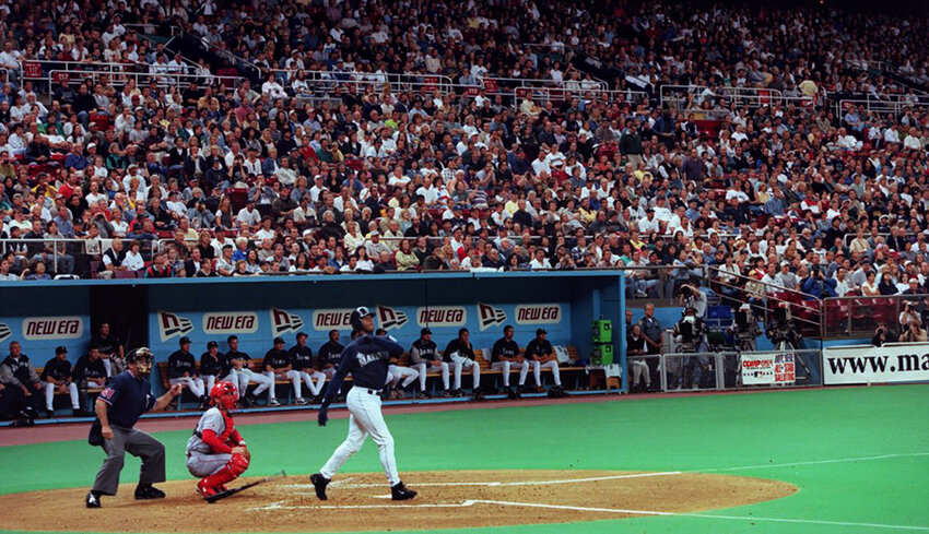 Ken Griffey, Jr. drops his bat and watches the last home run he will ever hit at the Kingdome sail away into the stands.  His first up in the last game -- first inning.  Mariners beat the Texas Rangers 5 - 2 in their last game in the dome. June 27, 1999.