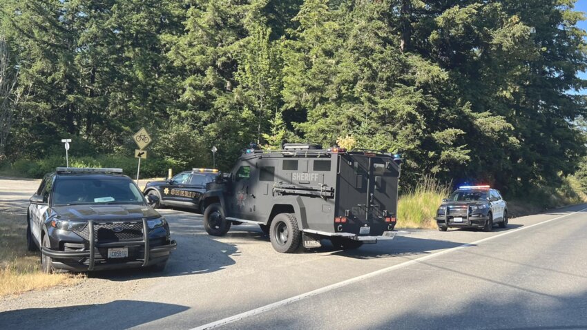 Thurston County Sheriff deputies arrested Jesse Fermon, 40, after he allegedly armed and barricaded himself inside a home on Johnson Creek Lane near Rainier Wednesday. Sheriff Derek Sanders shared this photo of the scene from State Route 507 on Facebook.