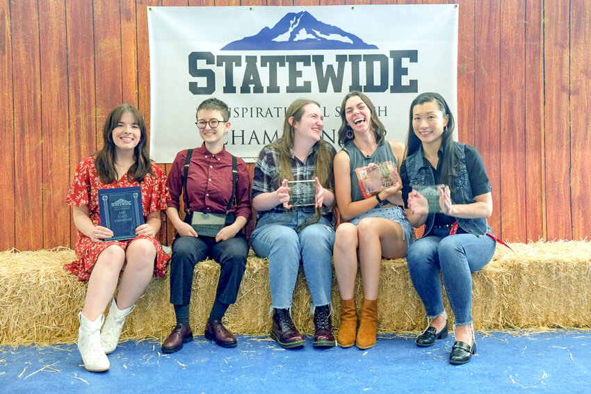 FILE PHOTO &mdash; Seated on the left, Onalaska resident Jasmine Preslicka poses with fellow competitors after the fourth annual Statewide Inspirational Speech Championship last year at Centralia College.