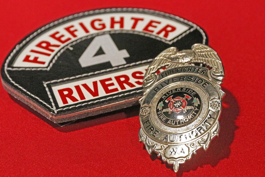 A Riverside Fire Authority badge and patch sit on display ahead of a badge pinning ceremony at Centralia High School on Wednesday, July 17.