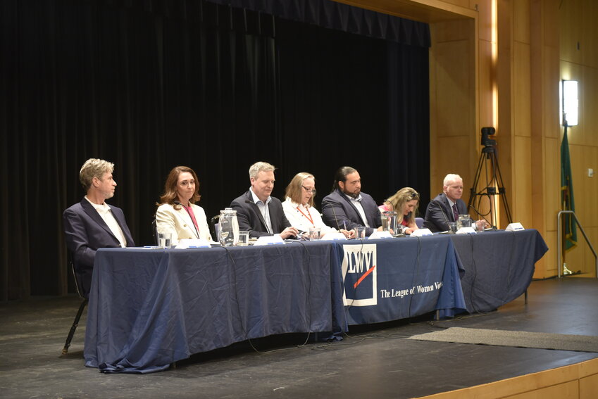 Allen Lebovitz (left), Jaime Herrera Beutler, David Upthegrove, Sue K. Pederson, Patrick DePoe, Jeralee Anderson and Kevin Van De Wege speak on their preferred policies if elected as Commissioner of Public Lands at a candidate forum hosted by the League of Women Voters of Washington, Thursday, July 18, at Clark College in Vancouver. The commissioner oversees over 5 million acres of state-owned land.