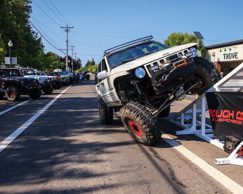 The first ever 4x4 show in Harvest Days flexed vehicle suspensions for canned-food donations at the corner of Parkway Avenue and Main Street in Battle Ground on Saturday, July 20.
