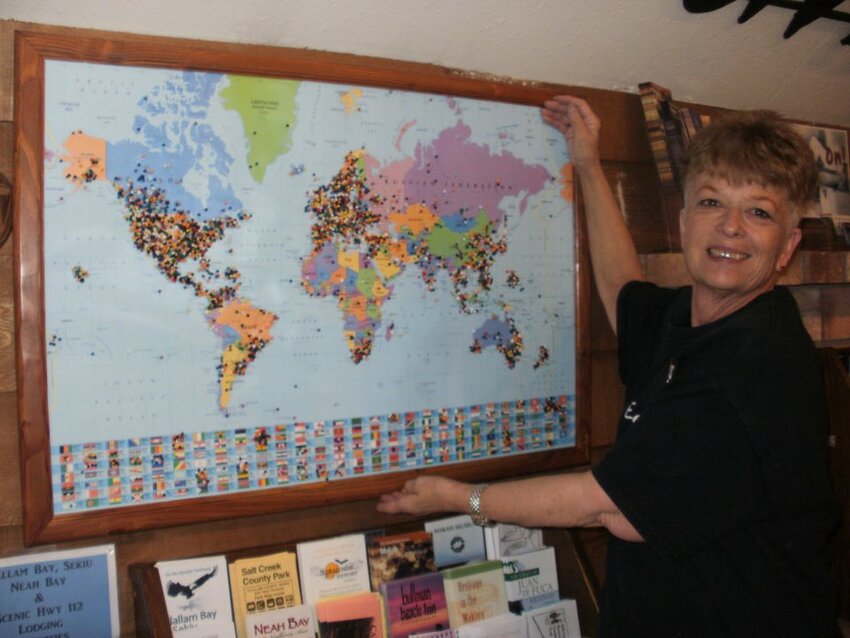 Visitors to the Forks Visitors Center use pins to mark their hometowns on this map showcased by a volunteer.