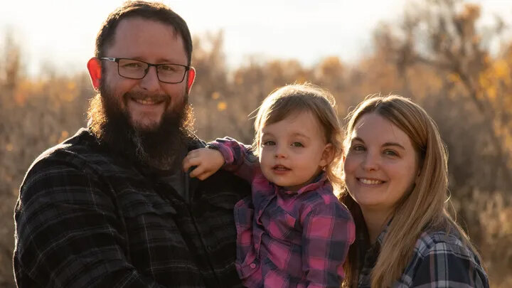 Devin and Casey Rearden, pictured with daughter Isabella, are raising money to help pay for Isabella's medical bills and treatment materials.