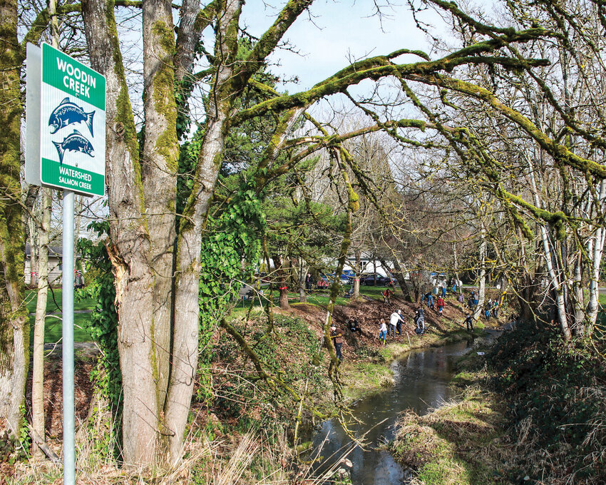 A watershed sign saying “Woodin Creek” is seen at Battle Ground’s Central Park, but it appears as Weaver Creek on a digital map.