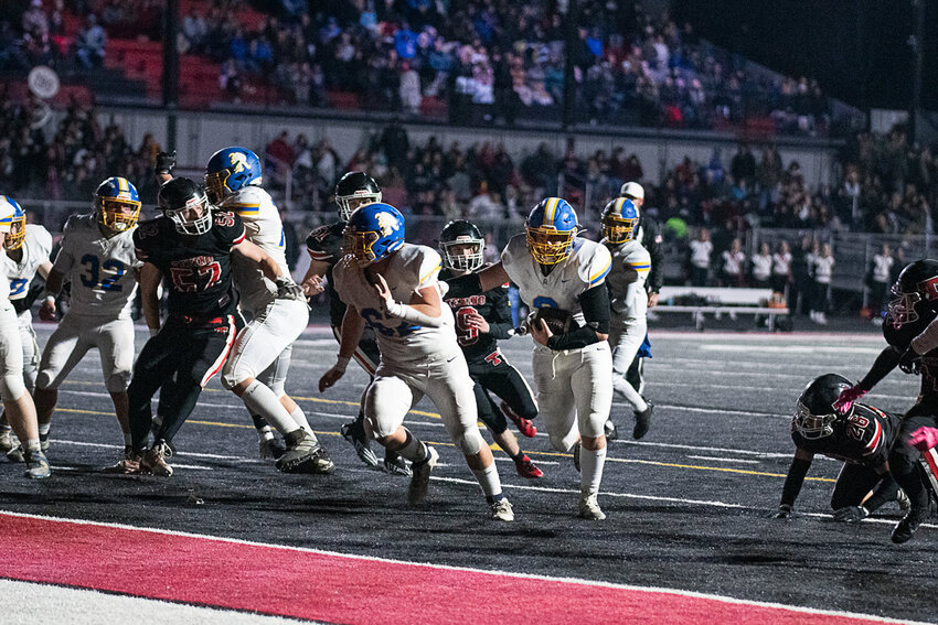 Mason Armstrong follows his lead blocker into the end zone for a touchdown during Rochester's win at Tenino on Oct. 27, 2023.