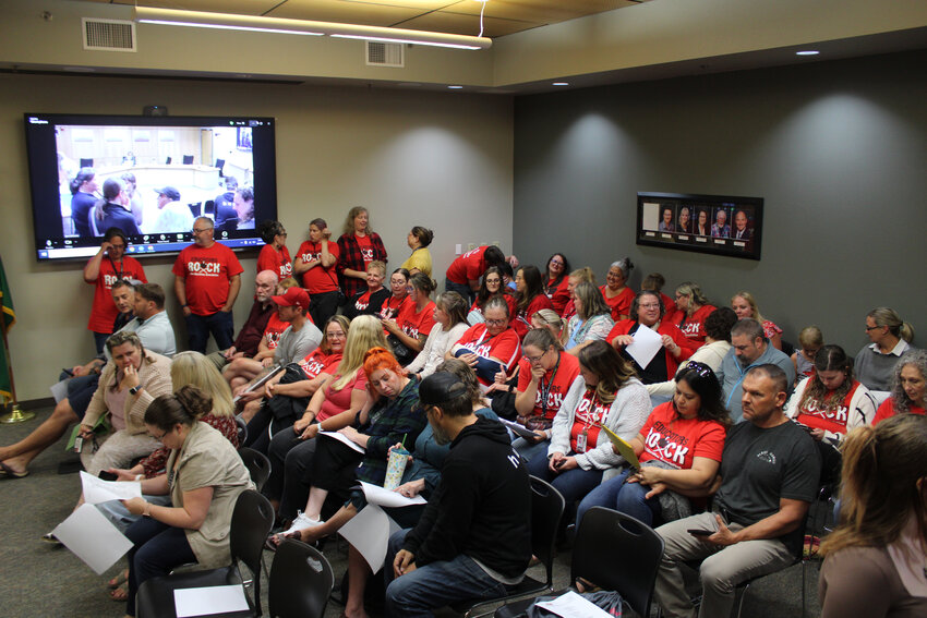 Dozens of Yelm Community Schools staff, many of whom representing the Yelm Education Association, pack the district office board room ahead of the Aug. 22 meeting.