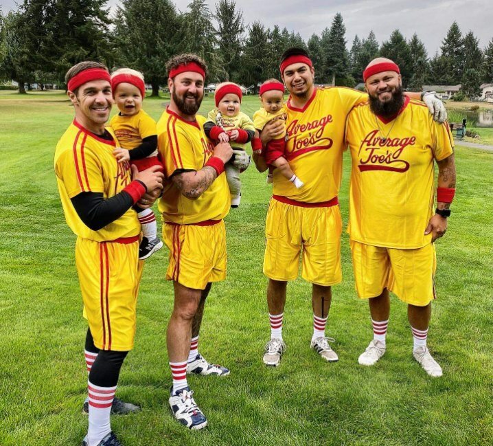 The winners of the “Cuffs N Trucks” golf tournament costume contest pose for a photo.