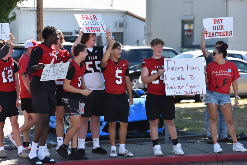 Yelm athletes voiced support for YEA and Yelm teachers in front of the district office on Thursday, Aug. 29.