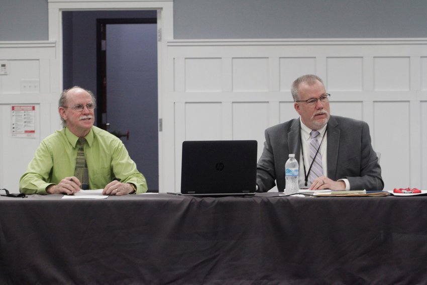 Moberly Area Community College Board of Trustees President Jim Cooksey, left, and MACC President Dr. Jeff Lashley listen to comments made during a Monday, Mach 22 trustees business meeting held at the college.