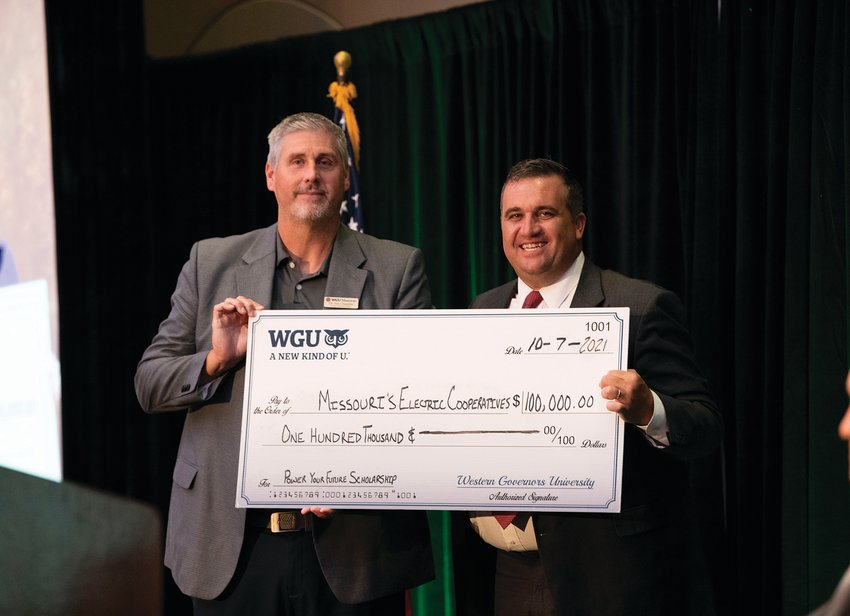 Jim Chandler (left), Strategic Partnerships Manager with WGU Missouri, presented AMEC CEO Caleb Jones (right) with a check for $100,000 to fund &ldquo;Power Your Future&rdquo; Scholarships for residents throughout the state. The check presentation was made during AMEC&rsquo;s annual meeting, held in late September. WGU Missouri is working with AMEC to award $100,000 in scholarships to co-op members and employees who are interested in furthering their education.