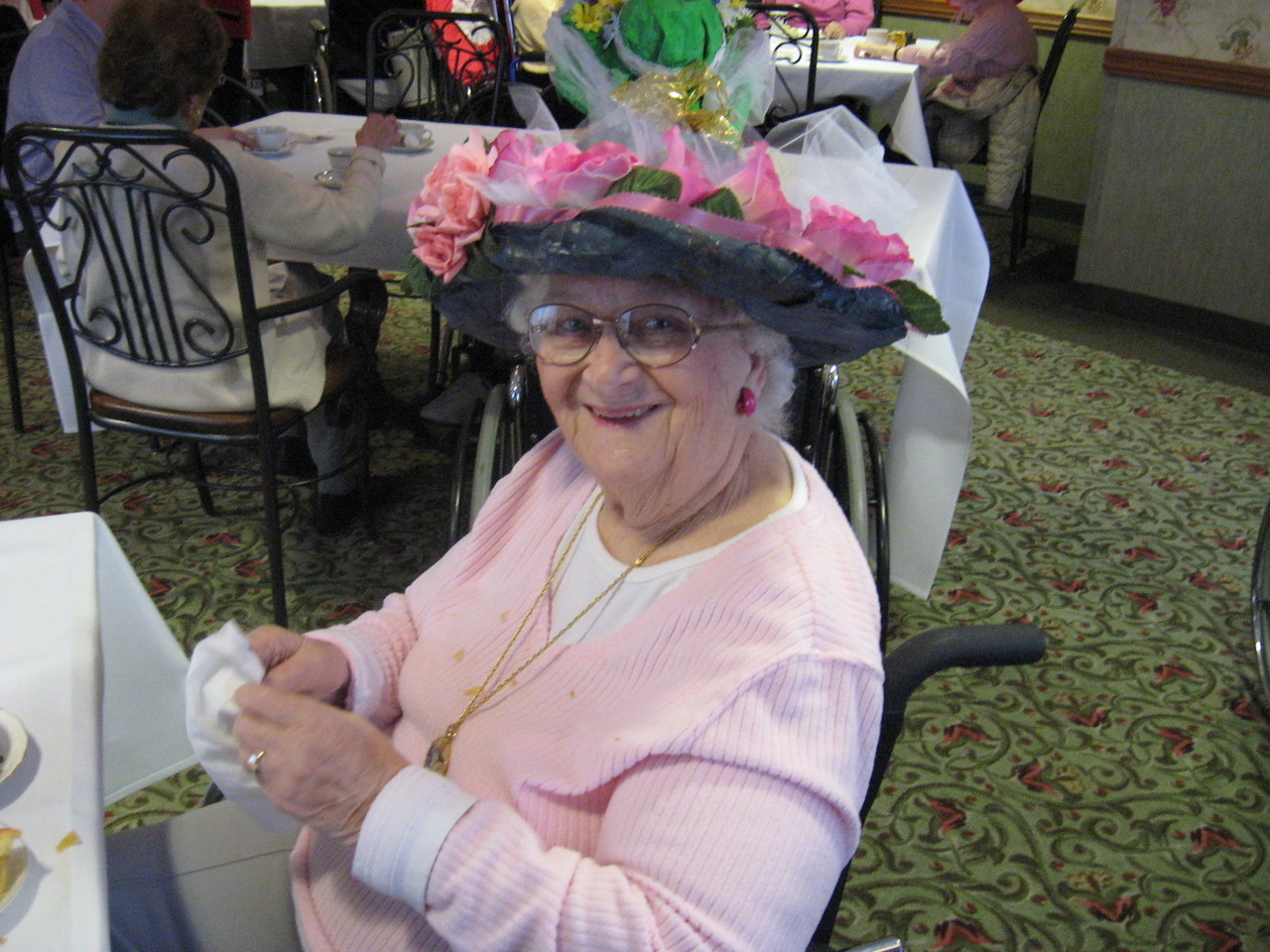 St. Antoine milliners display colorful creations at Red Hat tea party